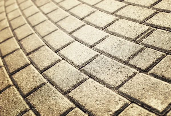 Sunlight on paved cobblestone pavement — Stock Photo, Image