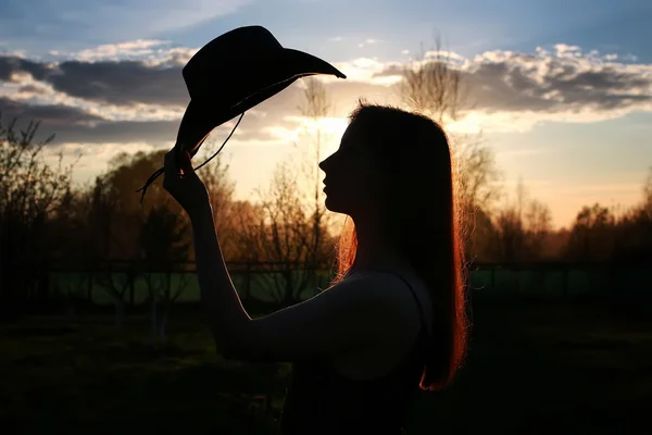 Ragazza silhouette cowboy — Foto Stock