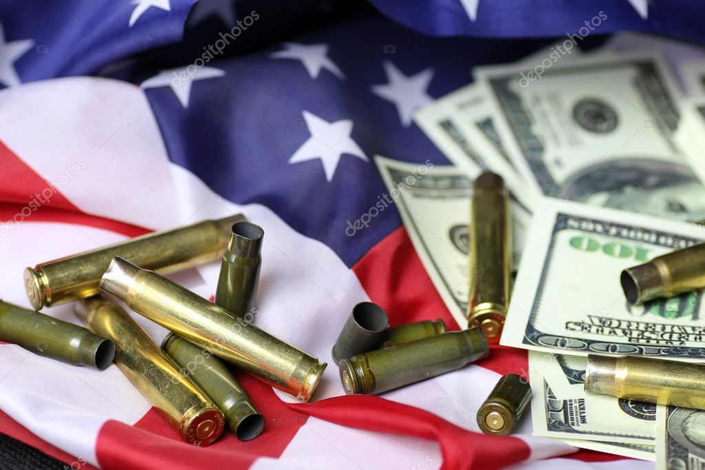 bullet and money on the american flag