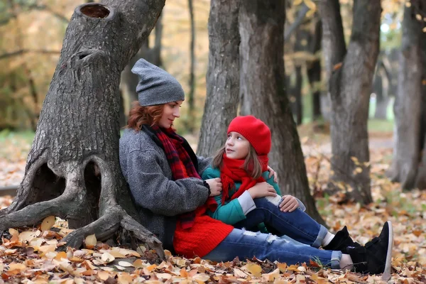 Woman and daughter autumn outdoor — Stock Photo, Image