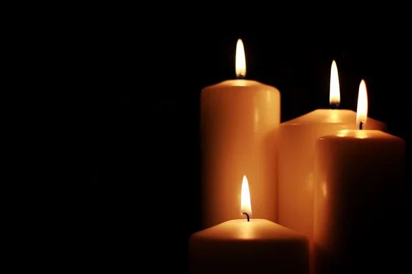 Candle light isolated black — Stock Photo, Image