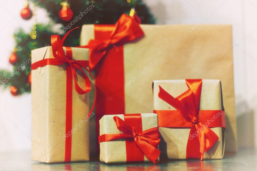 stack of gifts under a Christmas tree