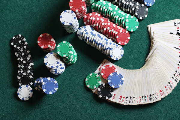 Poker chips and cards on the cloth