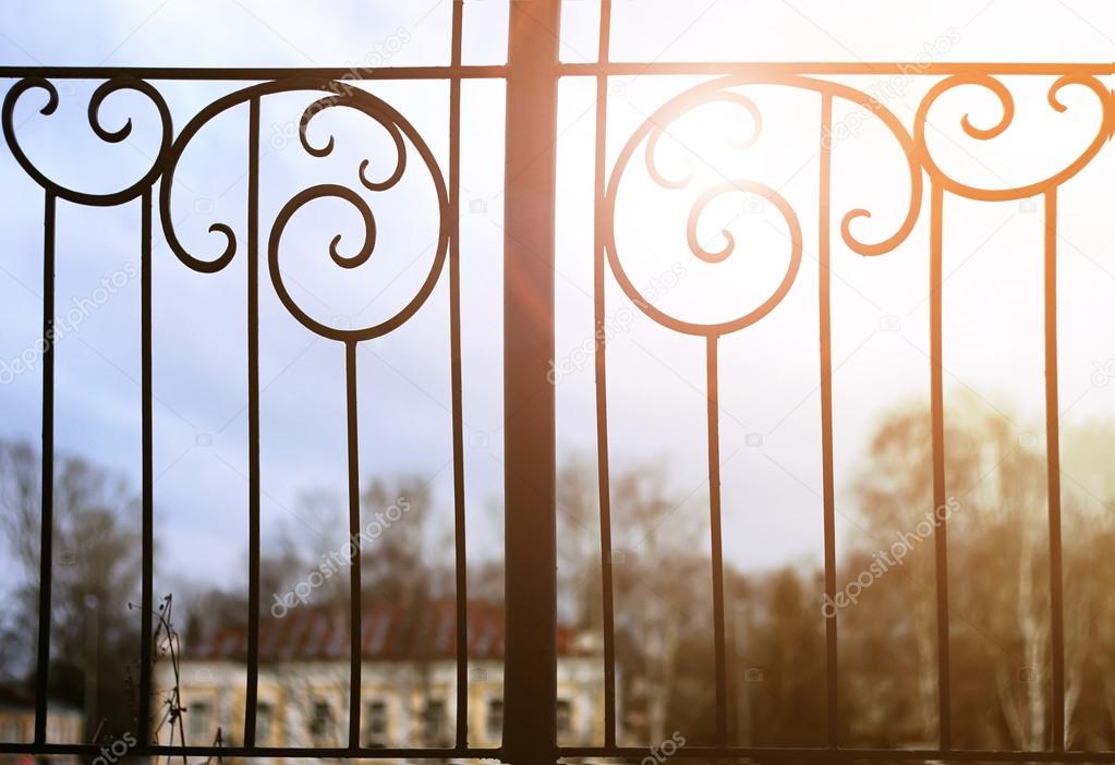 sunset and wrought gate