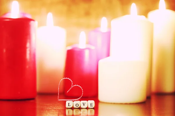 Makro svíčka světle s tvar srdce — Stock fotografie