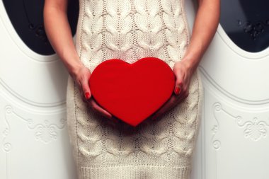 Woman holding heart clipart