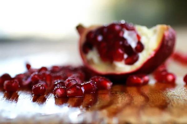 Pomegranate seed wood background — Stock Photo, Image