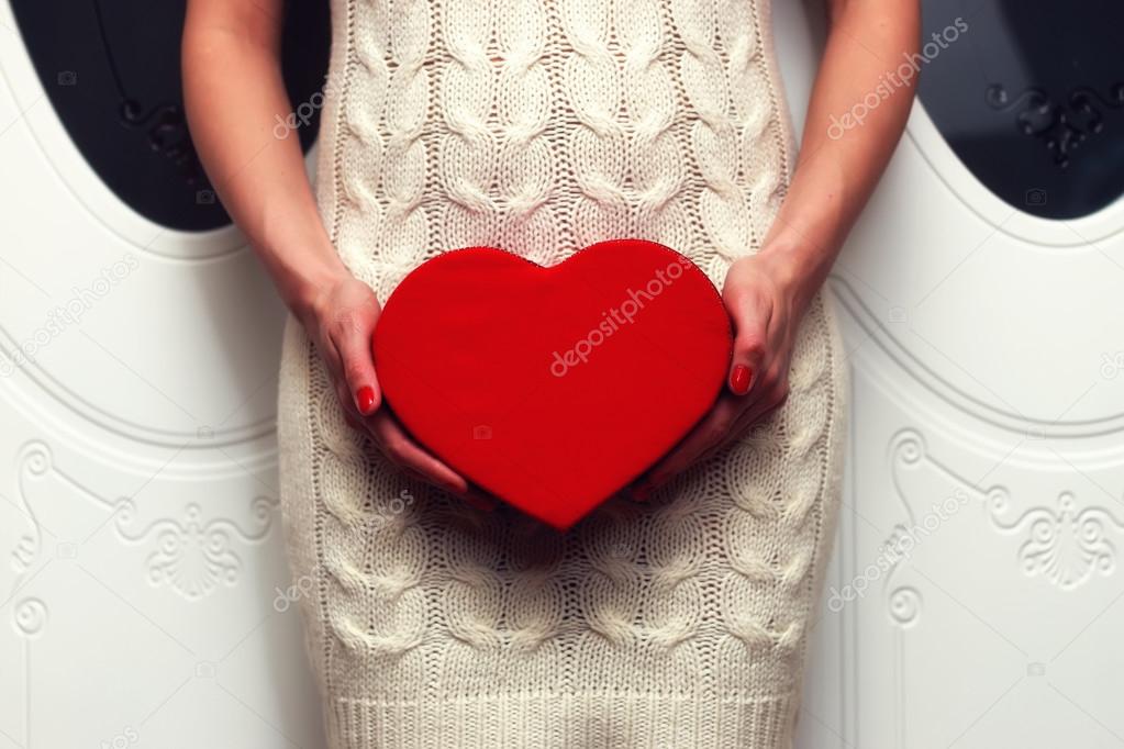 Woman holding heart