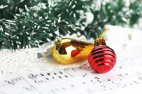 Notes and Christmas balls — Stock Photo, Image