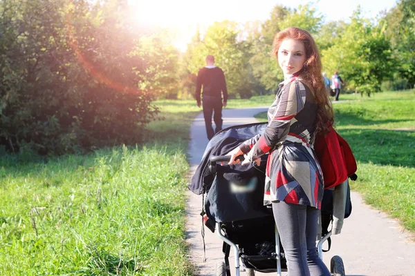 Walk women with stroller summer sunlight — Stock Photo, Image