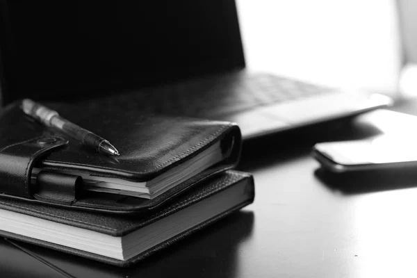 Office desk with a computer and a telephone diary — Stock Photo, Image