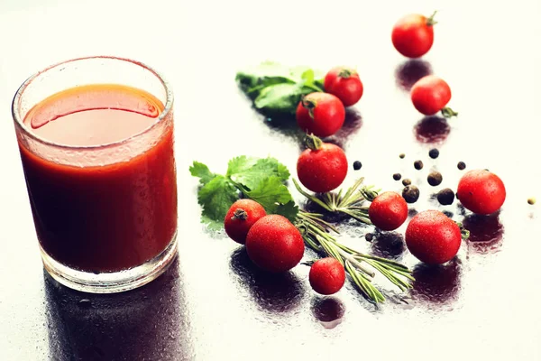 Glass of tomato juice drops — Stock Photo, Image
