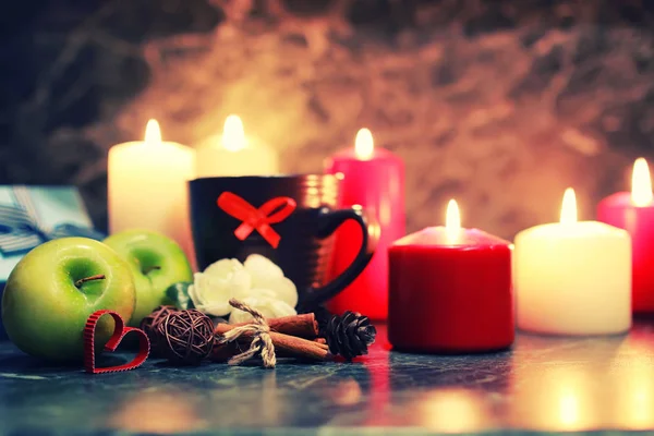 Night table with mug and candle — Stock Photo, Image