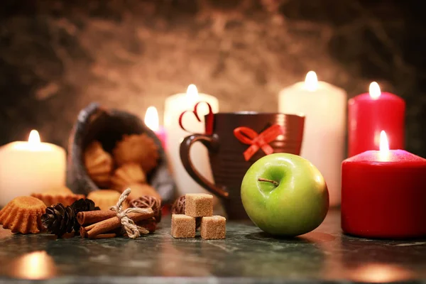 Night cup of tea with candle and apple — Stock Photo, Image