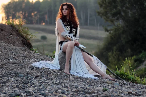 Girl with spear at the river — Stock Photo, Image