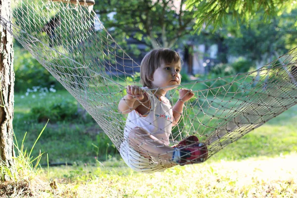 Little girl in hammock nature summer — Stock Photo, Image