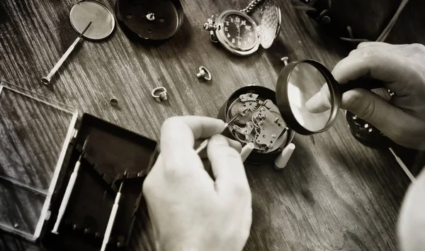 black and white photo watch clock repairing