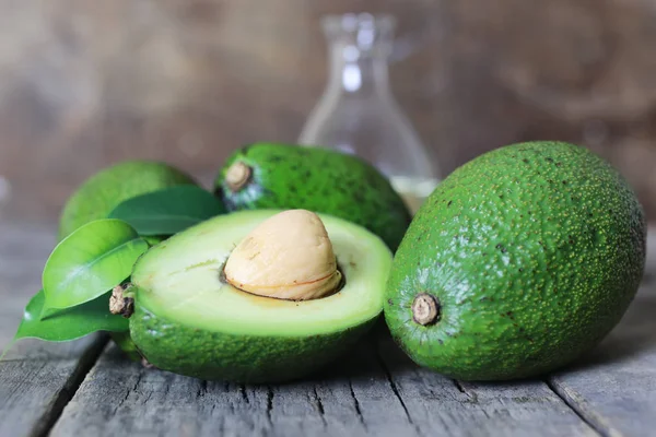 Avocado on wooden background — Stock Photo, Image