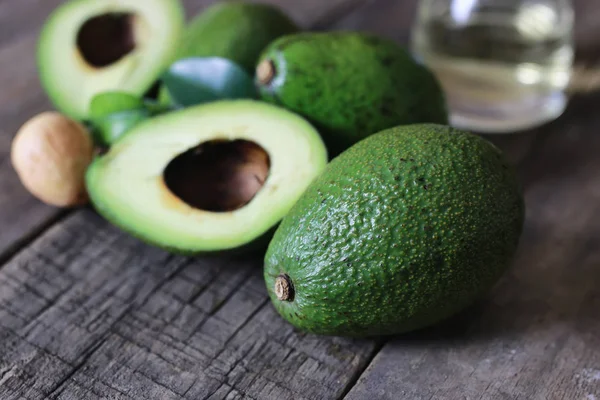 Avocado on wooden background — Stock Photo, Image