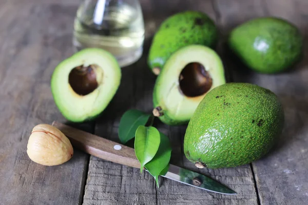 Avocado on wooden background — Stock Photo, Image