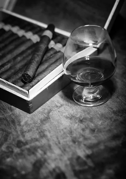 Retro styled photo of large box of Cuban cigars on a wooden tabl — Stock Photo, Image