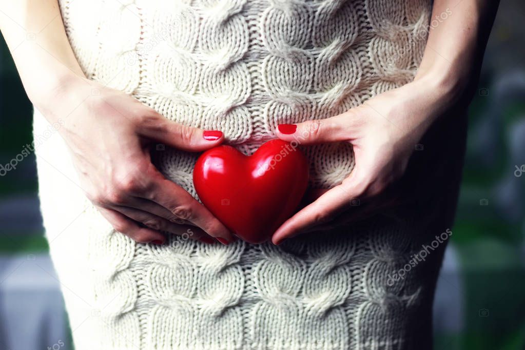 Woman holding heart