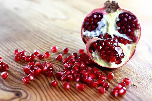 Pomegranate seed wood background — Stock Photo, Image