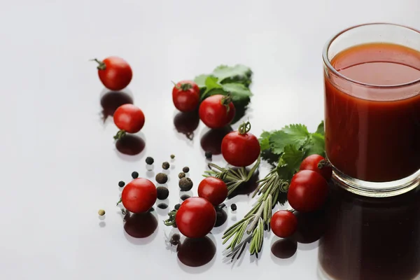 Glass of tomato juice drops — Stock Photo, Image