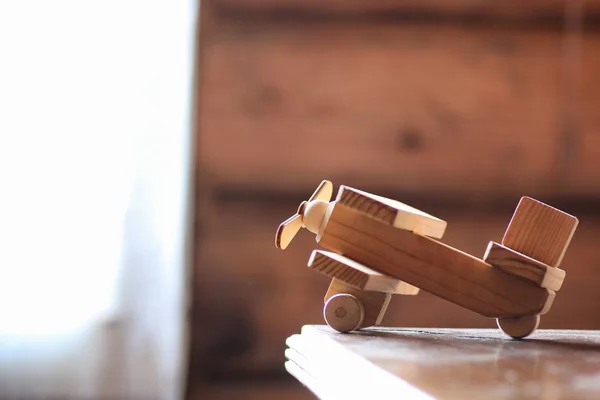 wooden toy airplane on the table