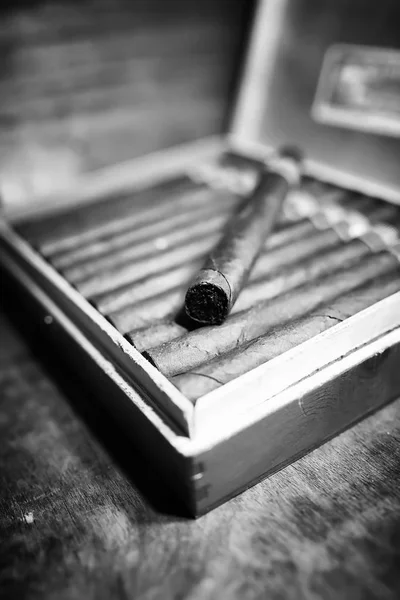 Retro styled photo of large box of Cuban cigars on a wooden tabl — Stock Photo, Image