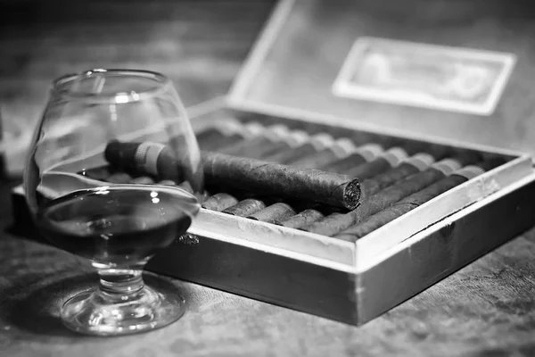 Retro styled photo of large box of Cuban cigars on a wooden tabl — Stock Photo, Image