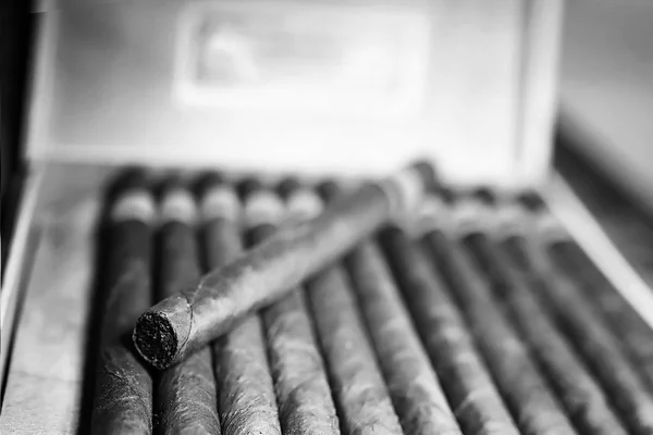 Retro styled photo of large box of Cuban cigars on a wooden tabl — Stock Photo, Image