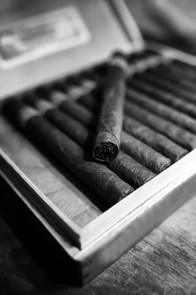 Retro styled photo of large box of Cuban cigars on a wooden tabl — Stock Photo, Image