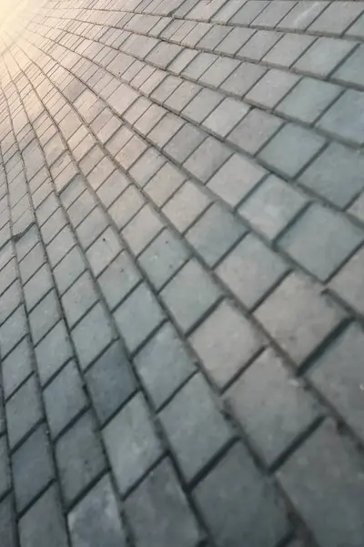 kaldırım taşı yol uzakta umudu'nde Günbatımı gider.