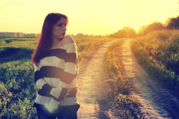 girl in hat fashion field sunset