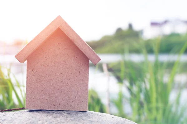 In the shape of a house a wooden figure — Stock Photo, Image