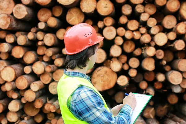 Man in helmet worker wood lumber — Stock Photo, Image