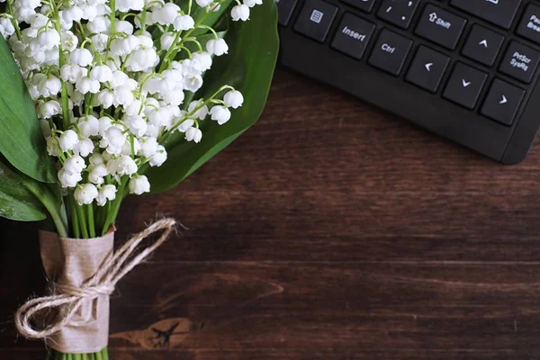 Bouquet of lilies of the valley on a table