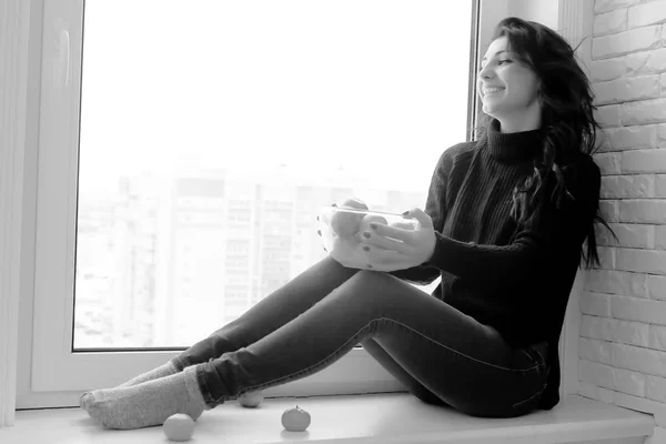 Girl at the window black and white — Stock Photo, Image