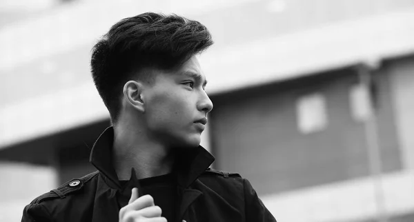 Black White photo of Asian young man outdoors posing — Stock Photo, Image