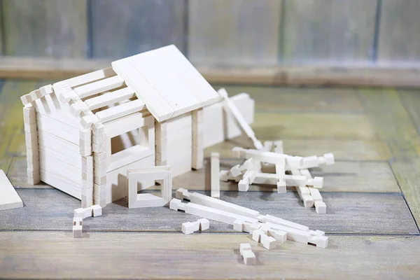 Toy wooden house. The constructor is made of natural wood for ch