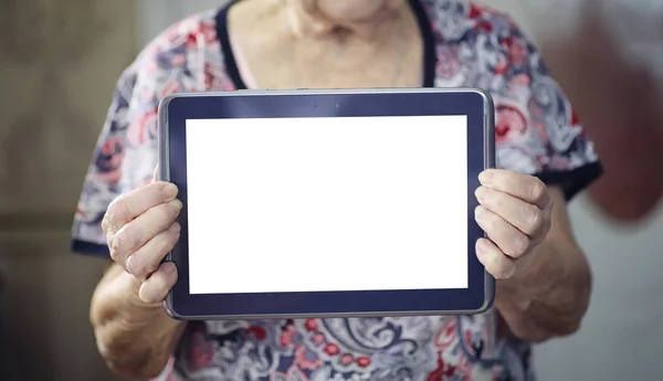 Elder woman holding tablet — Stock Photo, Image