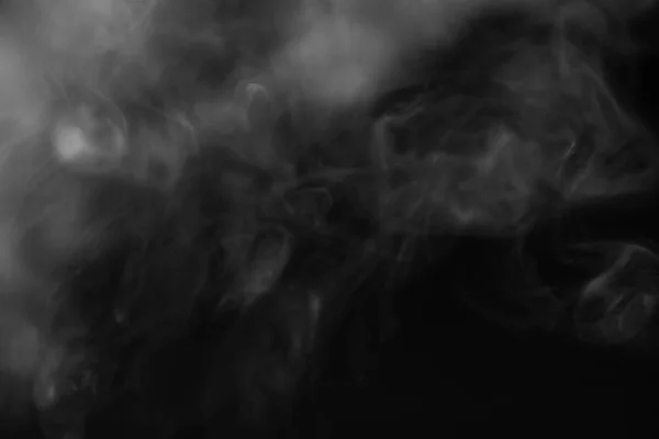 White smoke on a black background. Texture of smoke. Clubs of wh