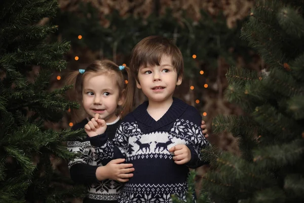 A little child by the New Year tree. Children decorate the Chris — Stock Photo, Image