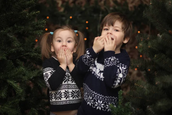 A little child by the New Year tree. Children decorate the Chris — Stock Photo, Image