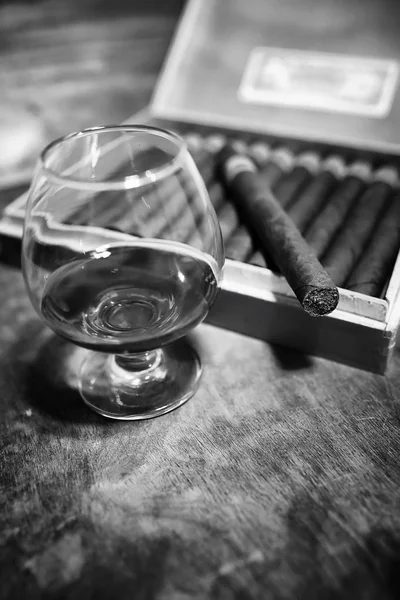 Retro styled photo of large box of Cuban cigars on a wooden tabl — Stock Photo, Image