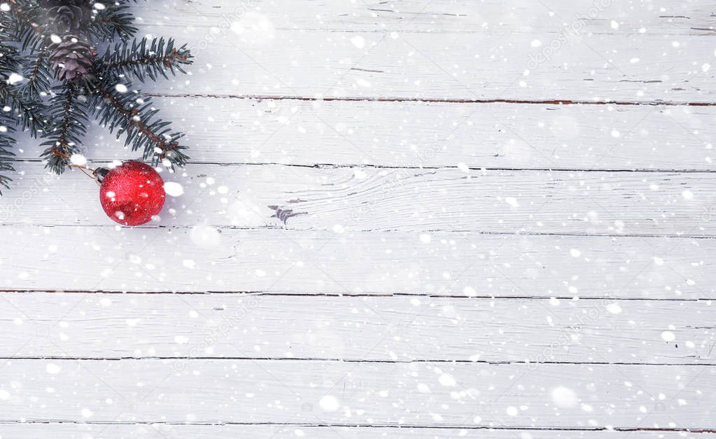 New Years background. Spruce branches on a wooden table. Orname