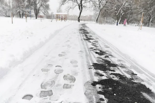 Footprints in the snow. Footprints on the first snow. Imprint of