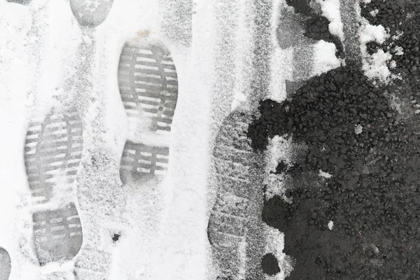 Footprints in the snow. Footprints on the first snow. Imprint of — Stock Photo, Image