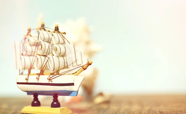 Old wooden ship with sails and masts toy on a stand. Vintage and — Stock Photo, Image